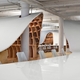 Illustration for article titled This gorgeous office has an endless desk made by robots